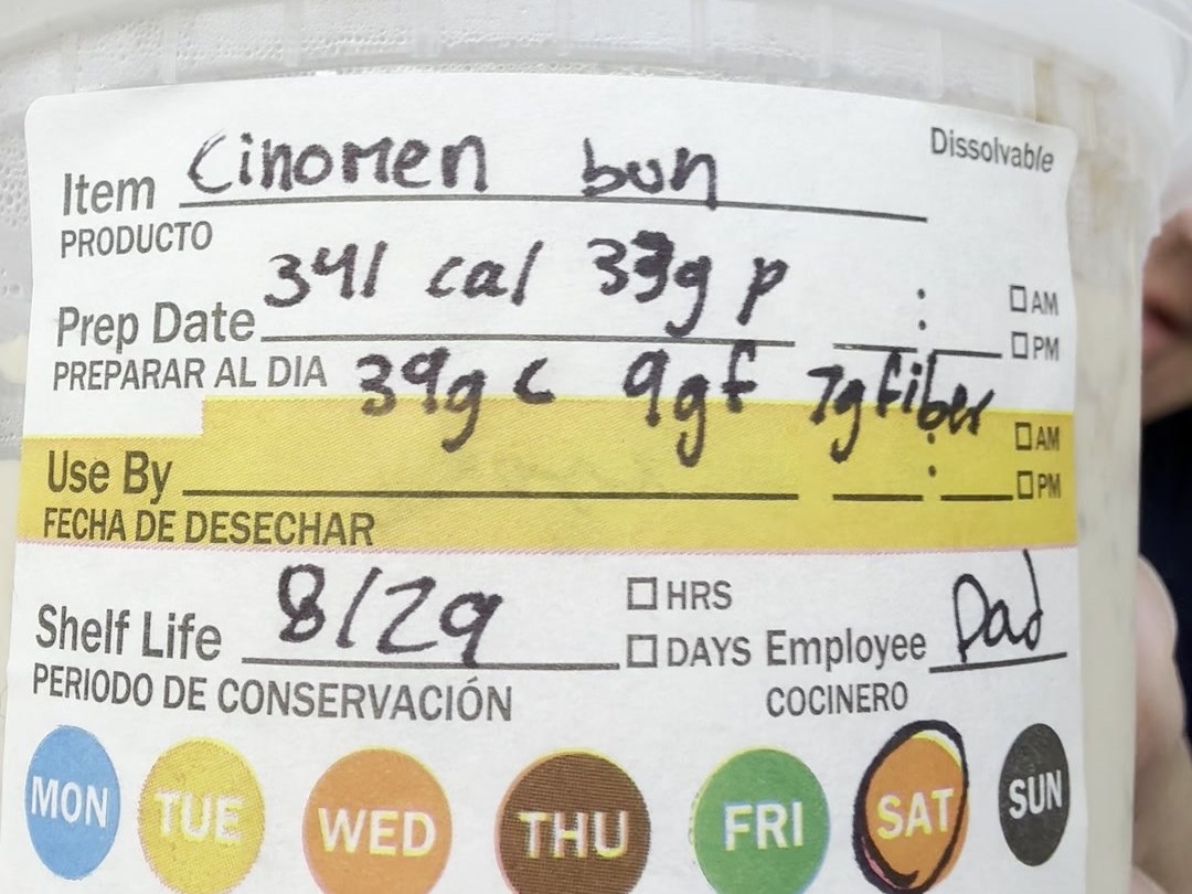 A prep label reading Cinomen bun in marker, macros written across the amber Use By bar, SAT circled in pen